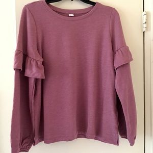 Pink sweatshirt with ruffles on sleeves